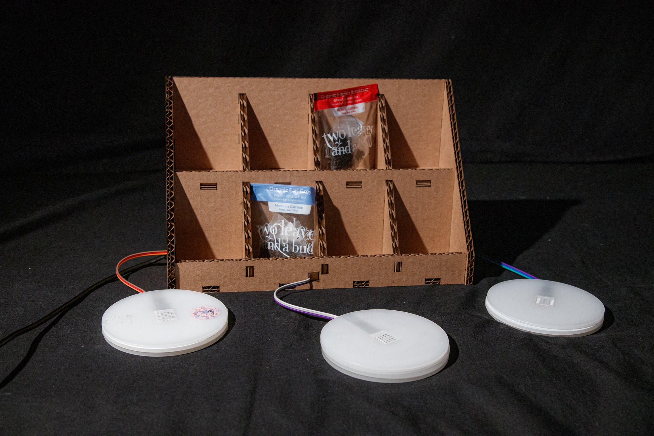 Front view of the fabricated tea display and three sensor coasters